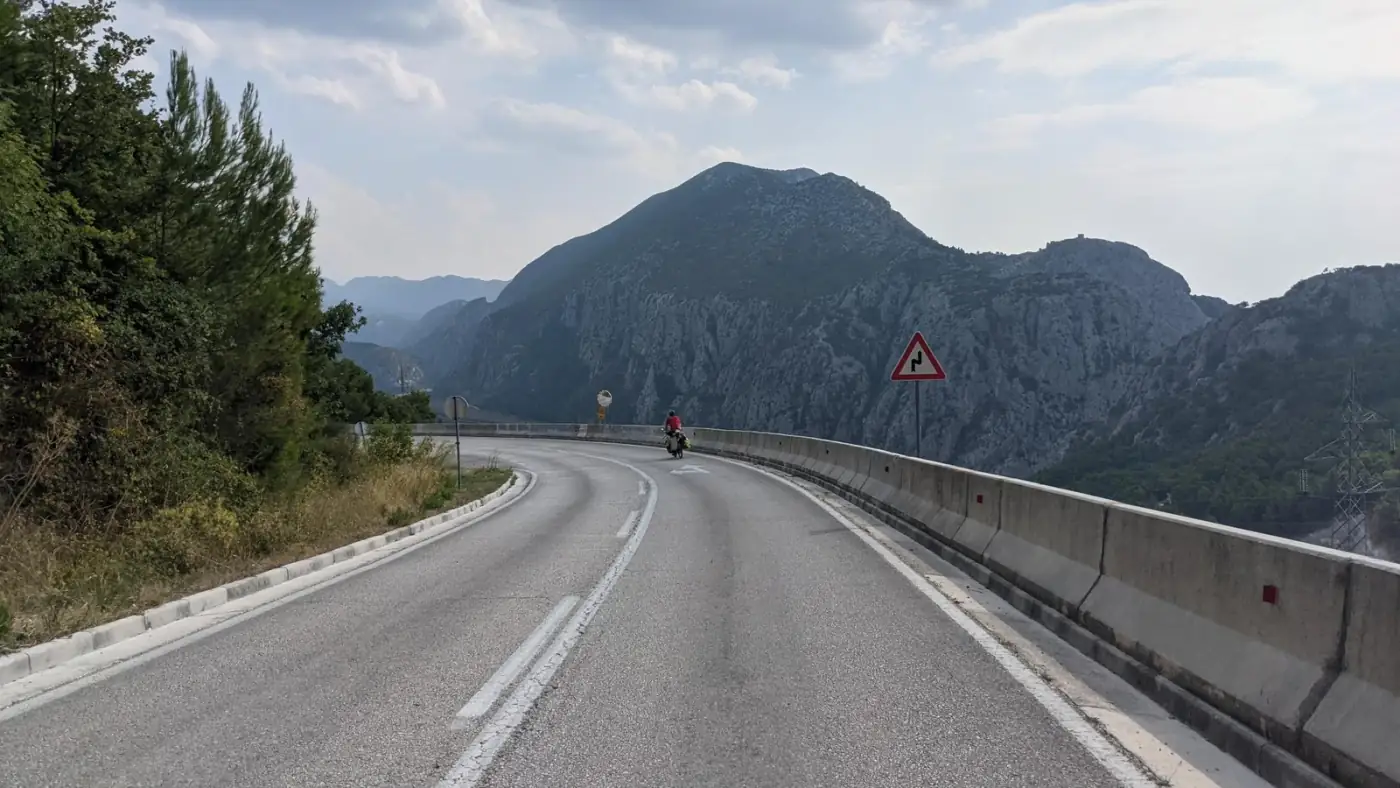 Day 1 in Croatia on our ride to Georgia: an empty road and the mountains ahead