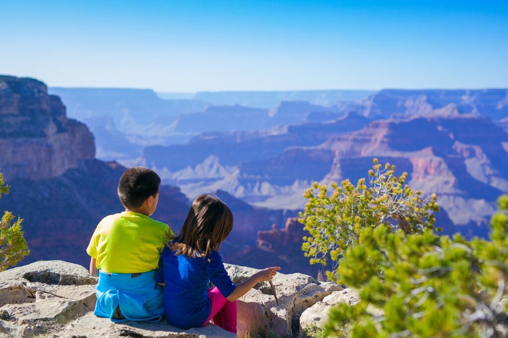 Child adventurers looking out over a canyon.