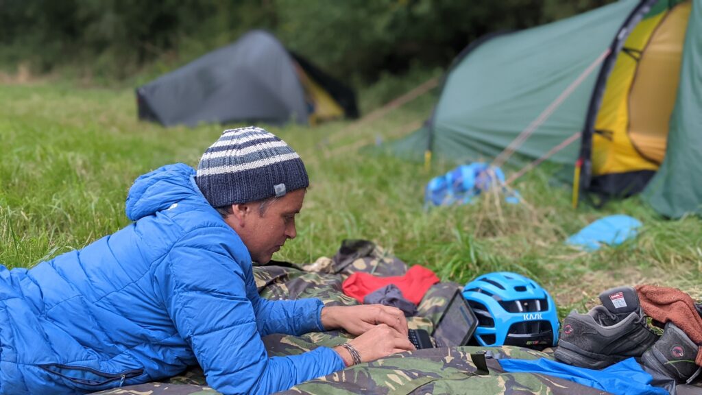 Simon working on Laptop at wild camping spot